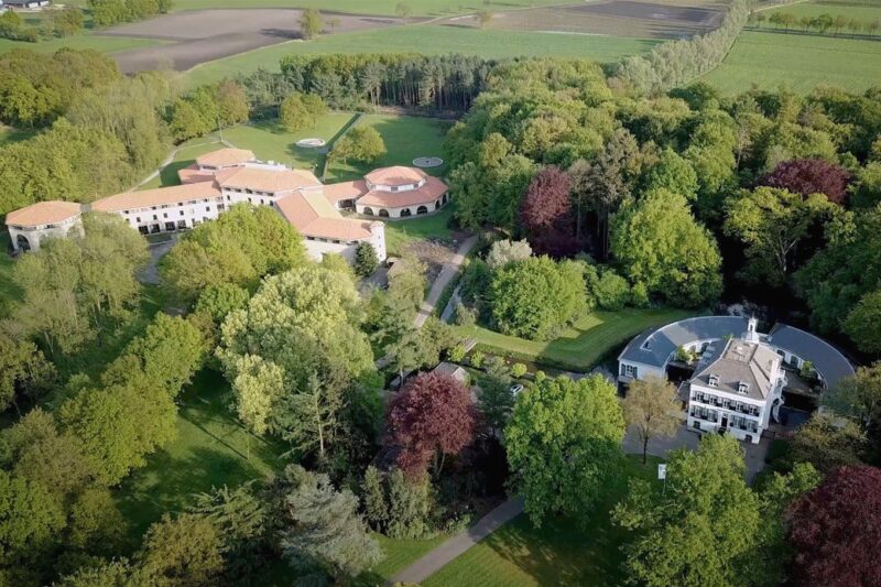 Aerial view of Yes We Can Youth Clinics and wooded grounds in Hilvarenbeek