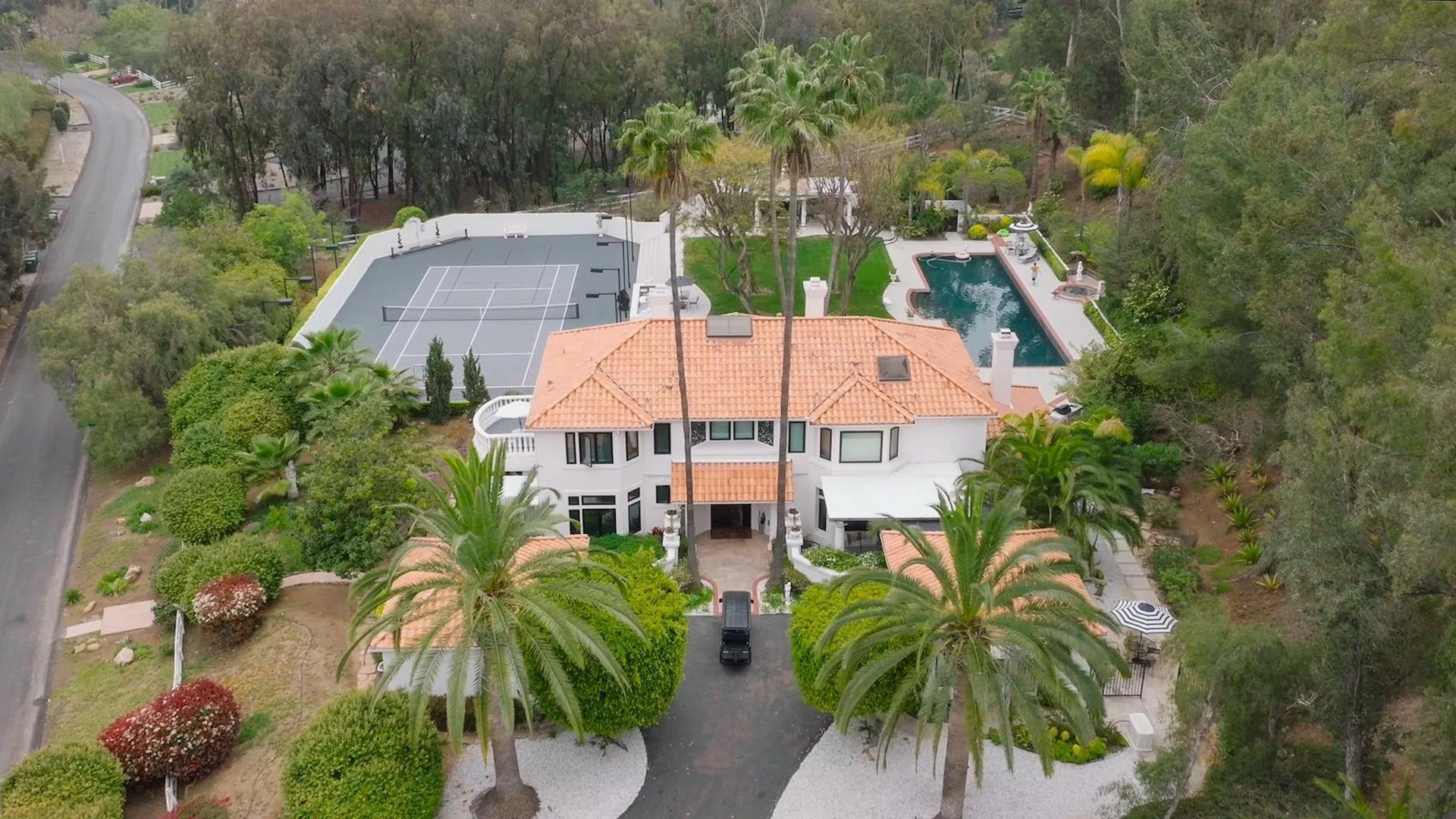 Aerial view of an AToN Center residence, pool and tennis court in Encinitas