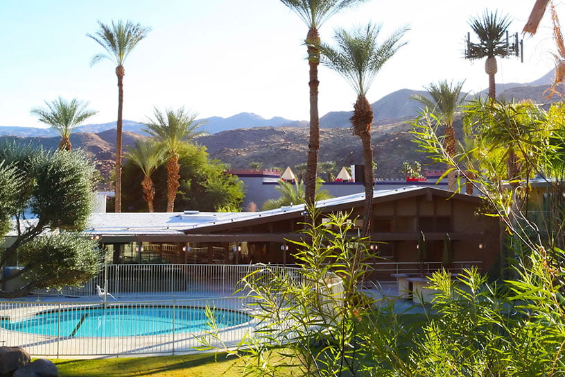 Outdoor pool and mountain view at Banyan Palm Springs in Cathedral City, California