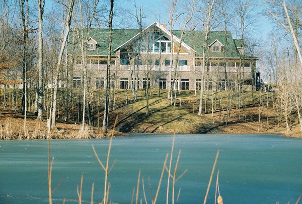 Wooded Glen Recovery Center campus viewed across the lake in Henryville, Indiana