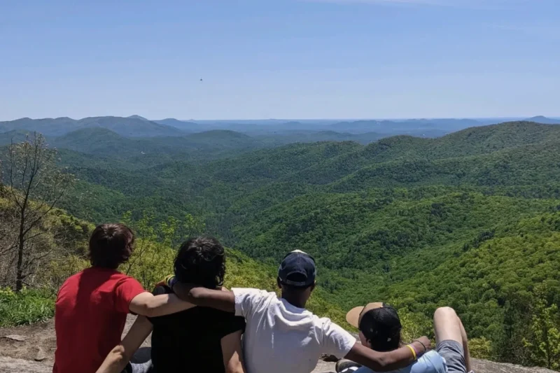 Young people overlooking the Blue Ridge Mountains at Eagle Overlook Recovery in Georgia