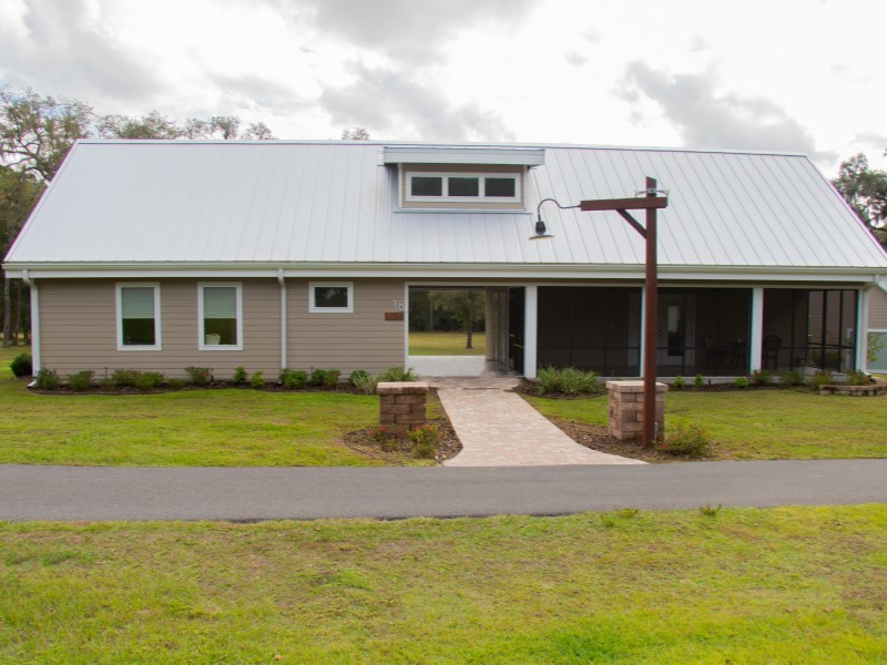 Cabin exterior and walking path at The Refuge in Ocala National Forest