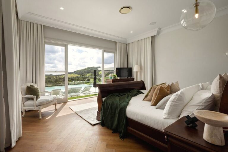 Private bedroom overlooking the pool and grounds at The Banyans