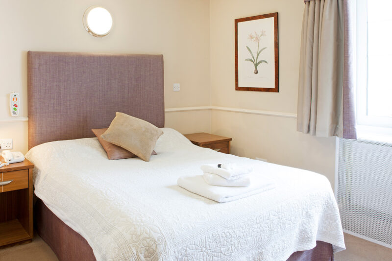 Bright patient bedroom at Priory Hospital Woking