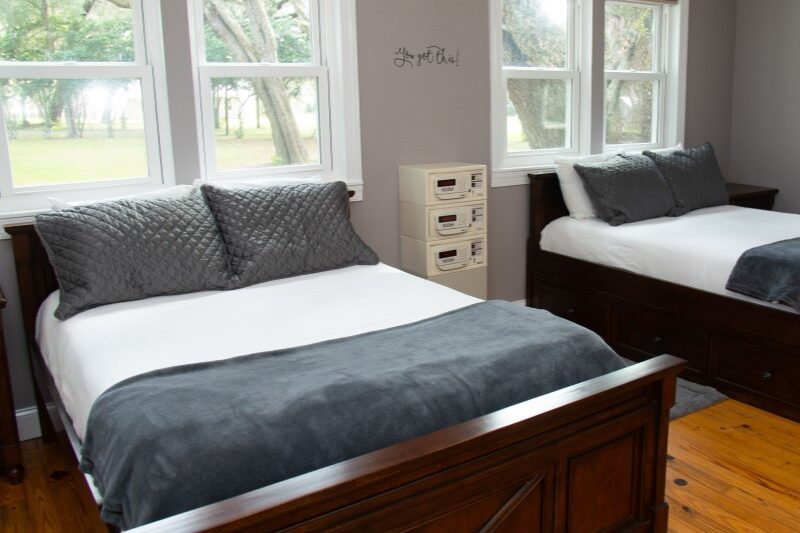 Cabin bedroom at The Refuge treatment campus in Ocklawaha, Florida