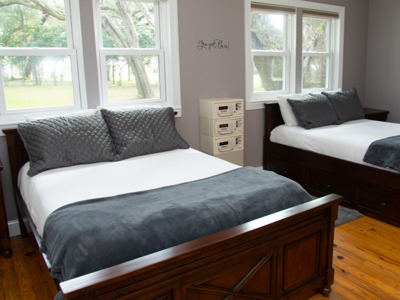 Cabin bedroom at The Refuge treatment campus in Ocklawaha, Florida