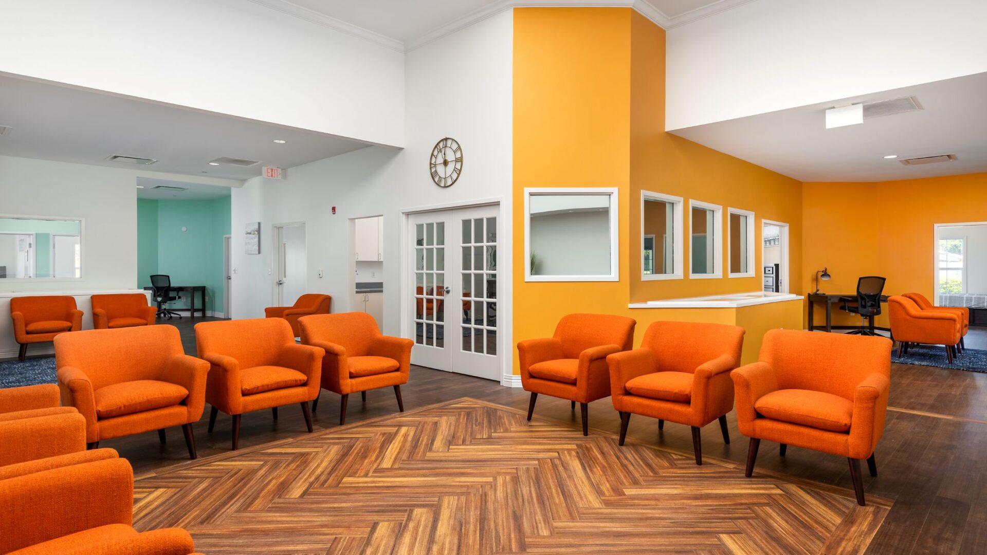 Orange-seated common area at the Discovery Mood and Anxiety Program residential center in Dade City, Florida