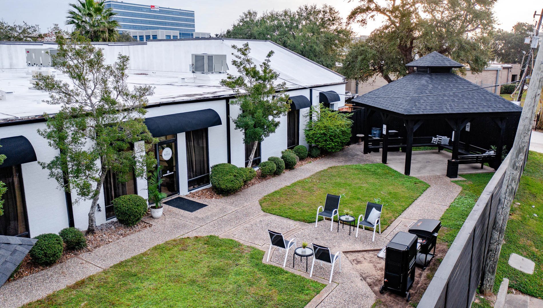 The Well facility with a landscaped courtyard and covered outdoor seating