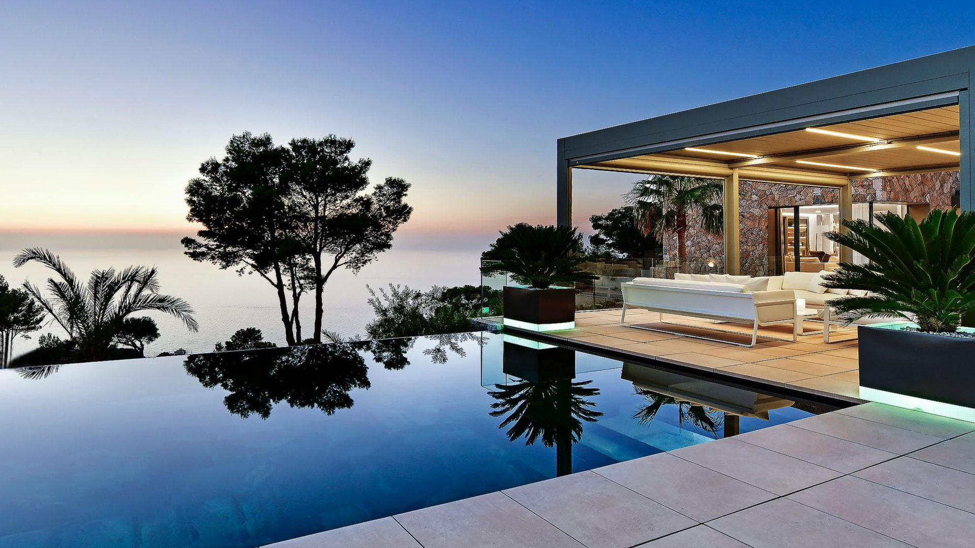 Sea-facing pool and covered terrace at a Bonaire Recovery villa in Mallorca