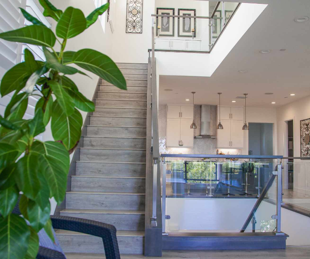 Interior stairway and living space shown by Capo by The Sea