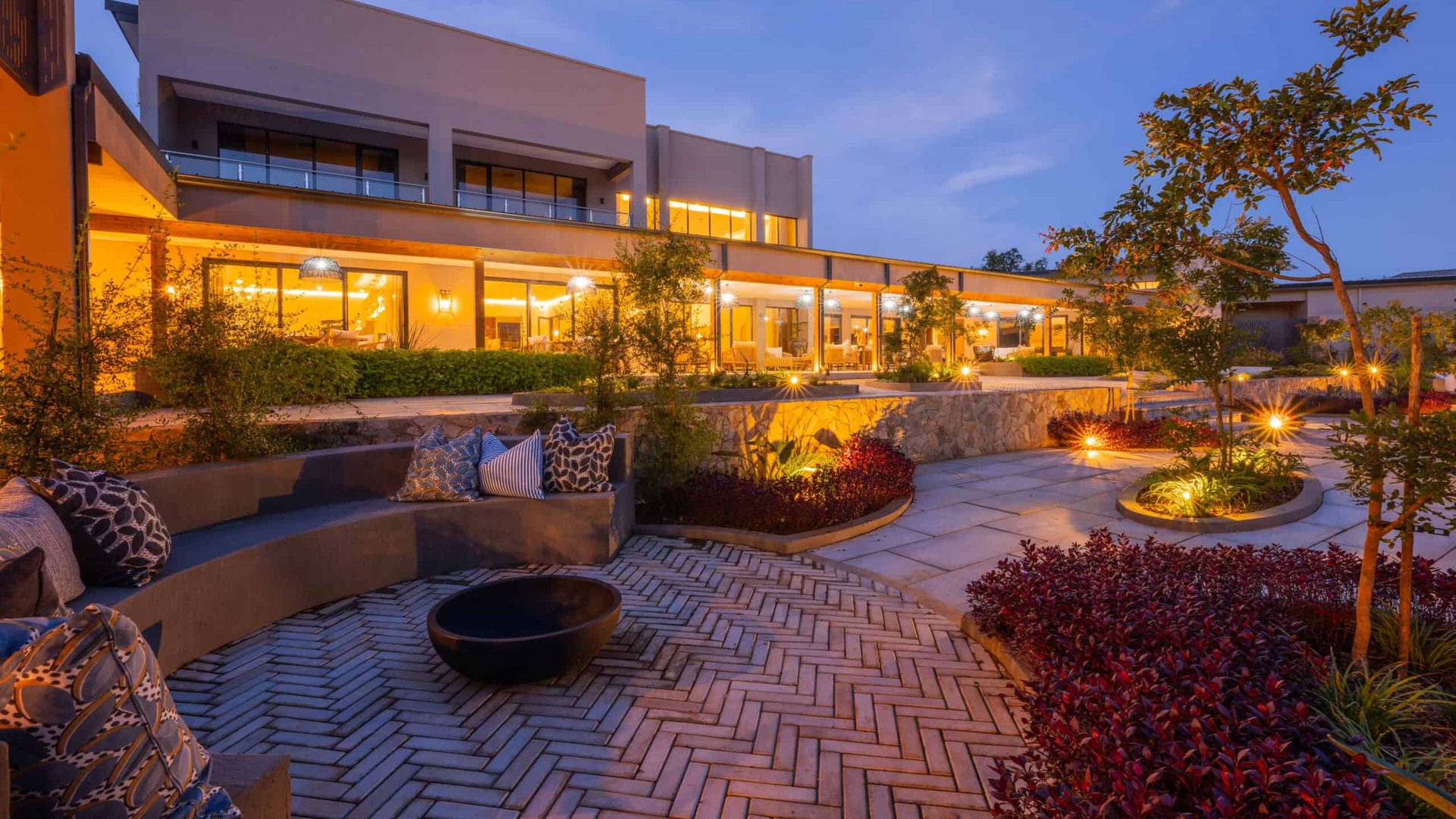 The Ark at White River building and landscaped gardens at dusk.