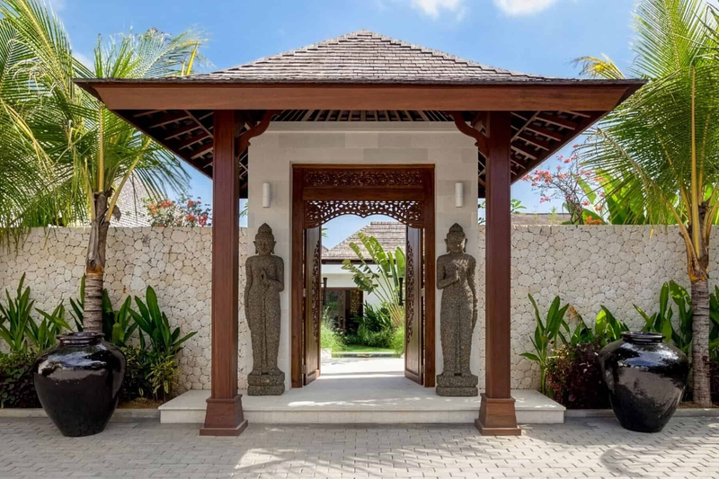 Private villa entrance with tropical planting, shown on the Istana Private website