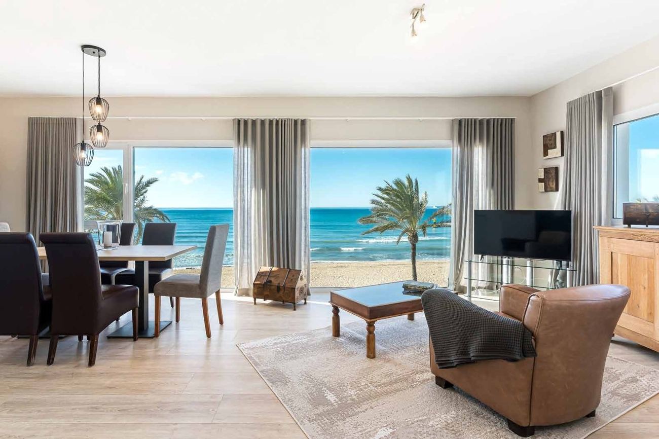 Living and dining room with sea views, pictured in the supplied SENSES program guide