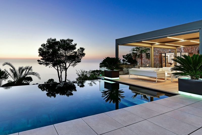 Sea-facing pool and covered terrace at a Bonaire Recovery villa in Mallorca