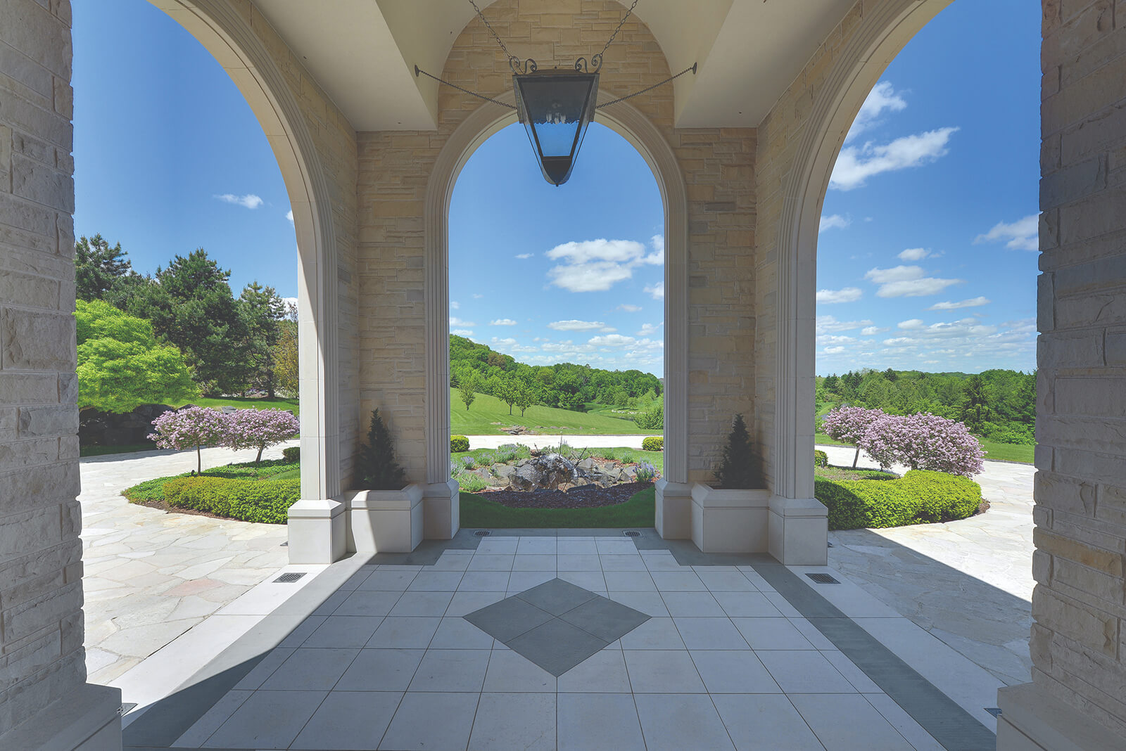 Arched entrance at The Manor overlooking landscaped grounds